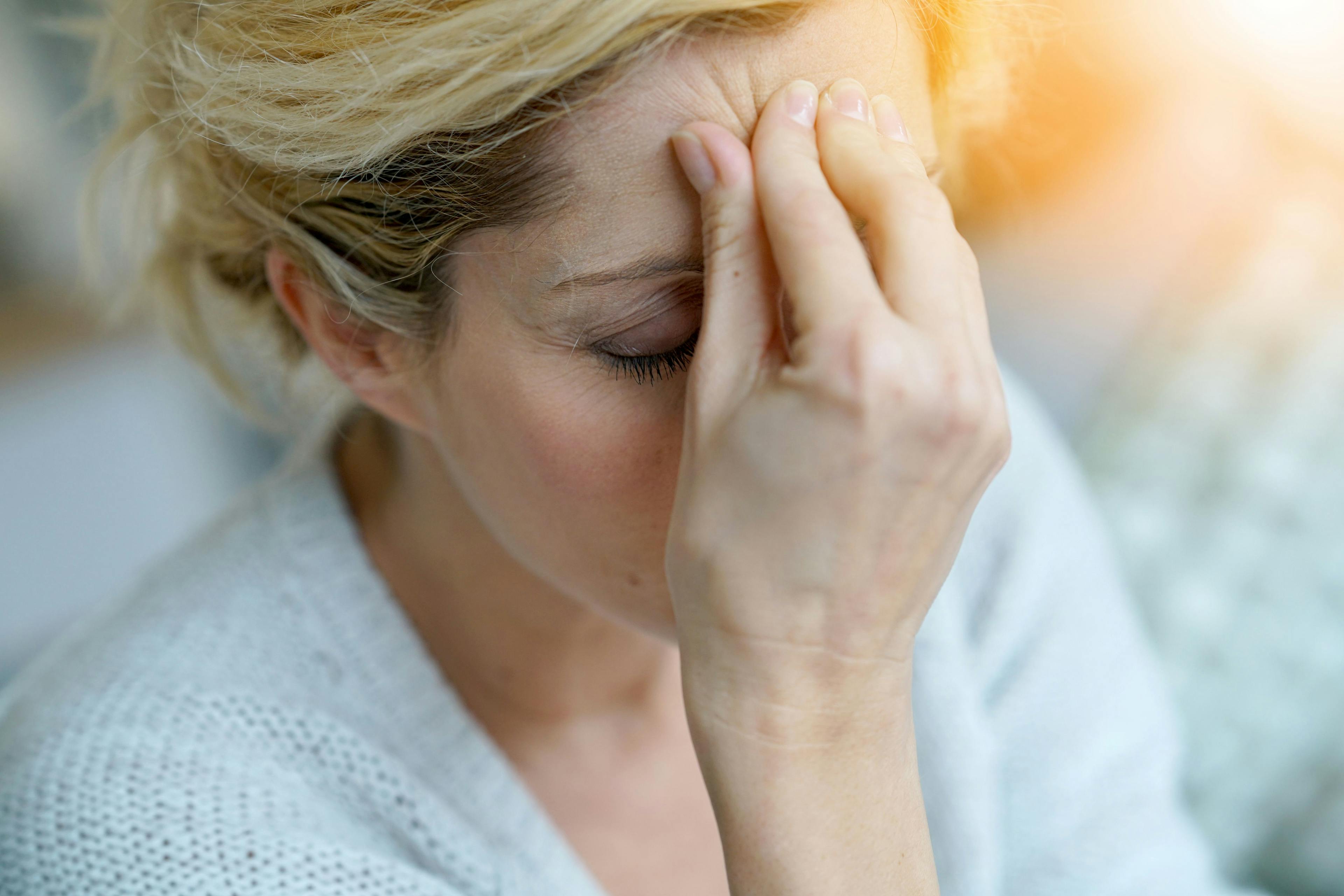 Portrait of middle-aged blond woman having a migraine | Image Credit: goodluz - stock.adobe.com